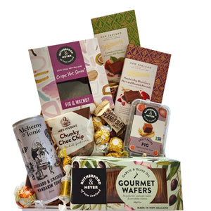 Our Gourmet Goodies box will make anyone’s day. What’s in the box? Whittaker’s artisan block Canterbury hazelnut and creamy milk chocolate x1 Rutherford & Meyer garlic and olive oil gourmet wafers x1 Mrs Higgins cookie x1 Rutherford & Meyer fig fruit paste Whittaker’s artisan block Hawkes Bay black Doris plum and roasted almond x1 Alchemy & Tonic rhubarb & smashed mandarin tonic x1 Ferrero Rocher x2 Rutherford & Meyer fig and walnut crips x1 Werther’s assorted x4 Whittaker’s mini slabs x2 Lindt balls x2