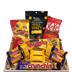 This is chocolate box is honeycomb heaven! Filled with sweet treats to make anyone’s day a little brighter. This gift box would make a perfect gift for hokey pokey lovers or treat yourself.  What's in the Box?  Mini crunchies x4 Crunchie bar x1 Squiggles x1 Whittaker’s hokey pokey minis x4 Nestle Kit Kat honeycomb slab x1 Squiggles bites x1 Donovan’s hokey pokey clusters x1 Optional: Personalised hand written card within a wax sealed envelope
